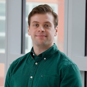 Yousef Alish Data Analyst Headshot wearing green top