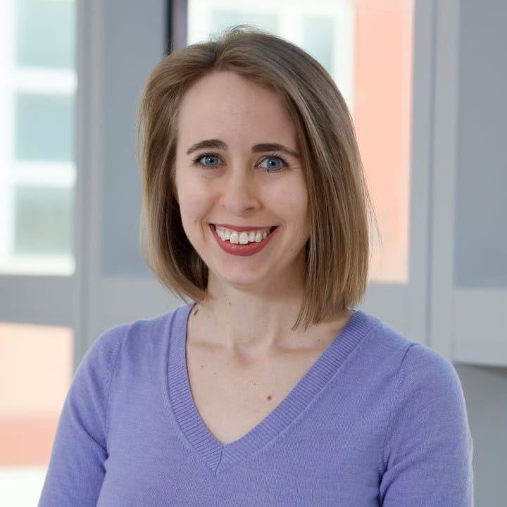 Mariah Eisner Headshot wearing purple