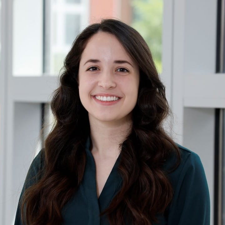 melica nikahd ohio state university wexner medical center headshot with deep green shirt.