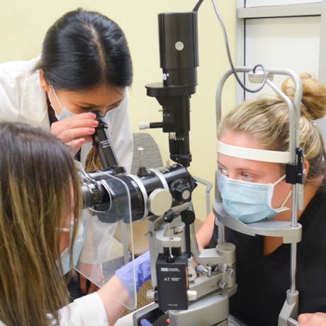 Optometry resident conducting exam