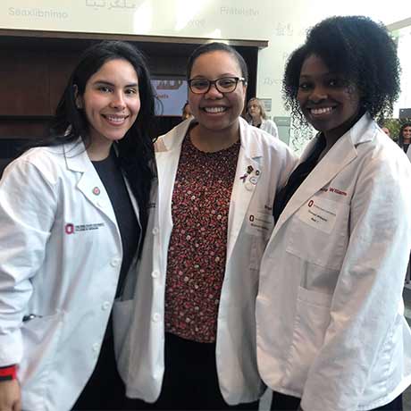 Three women attending the Women in White Coats event