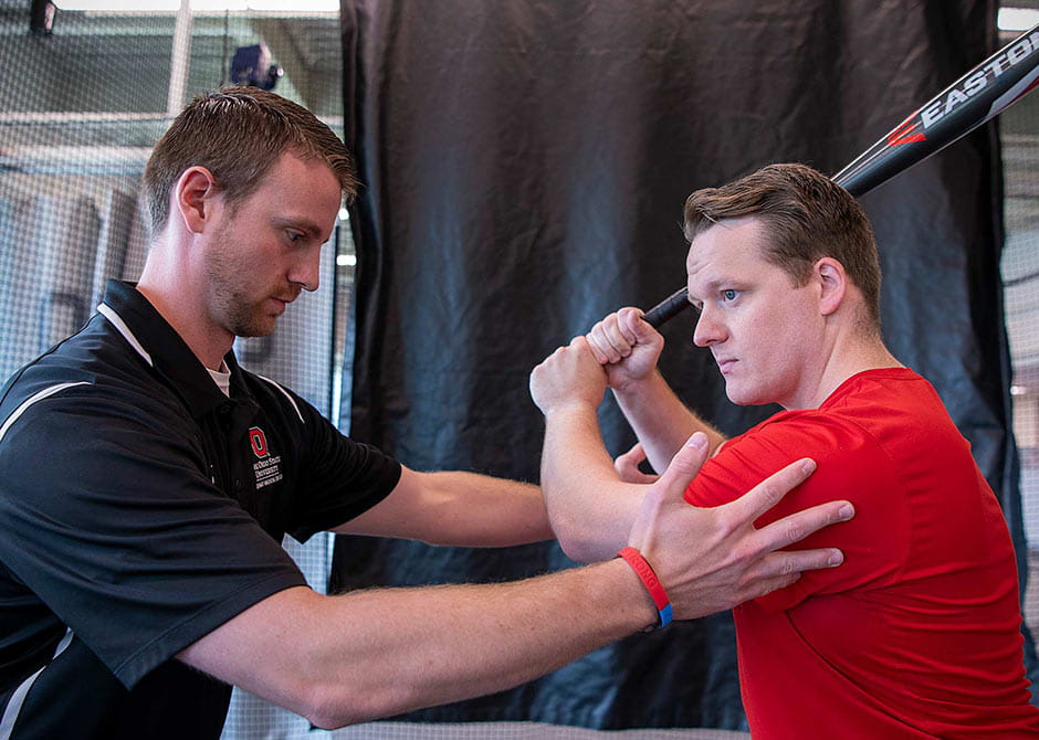 Physical therapy specialist helping an athlete