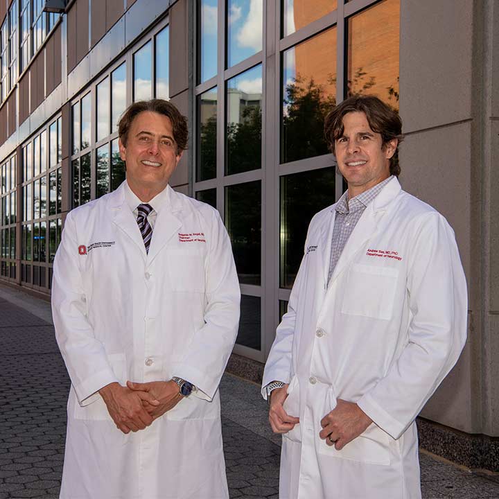 Dr. Segal and Dr. Sas posing together outside
