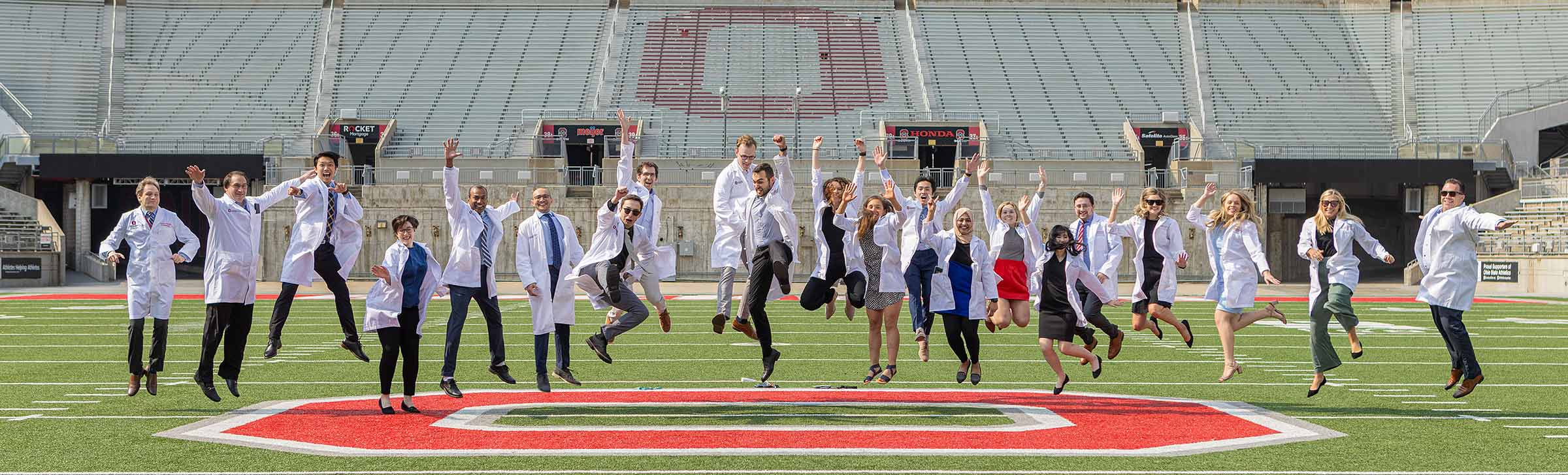Anesthesiology residents in a jump at the Ohio State stadium