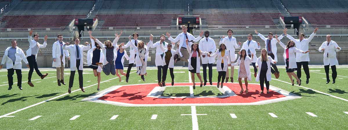 Third year residents in a jump at the Ohio State stadium