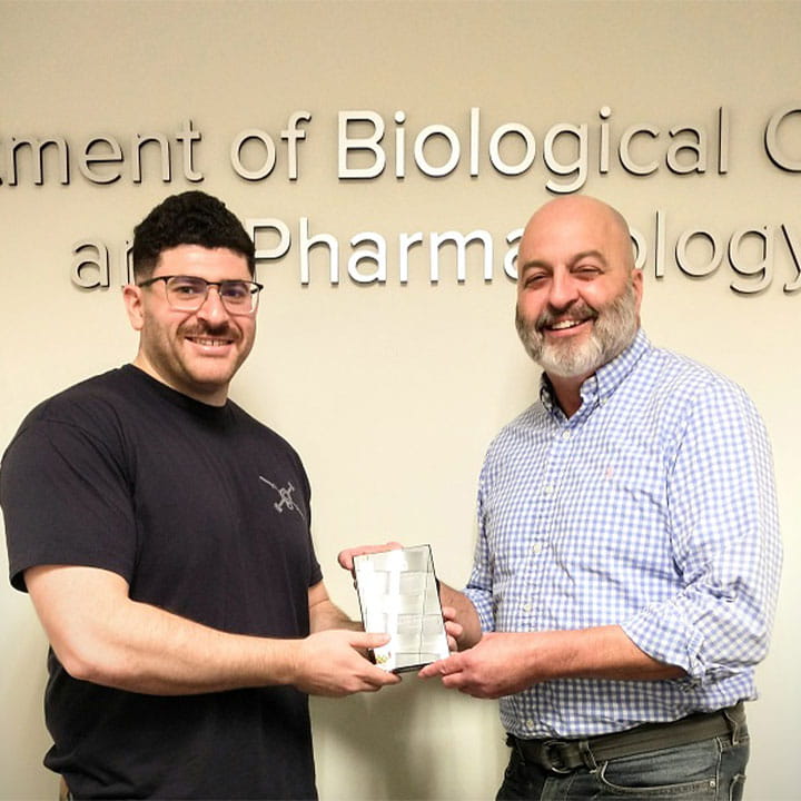 Benjamin Pastore receiving the Johnson Academic Excellence Award