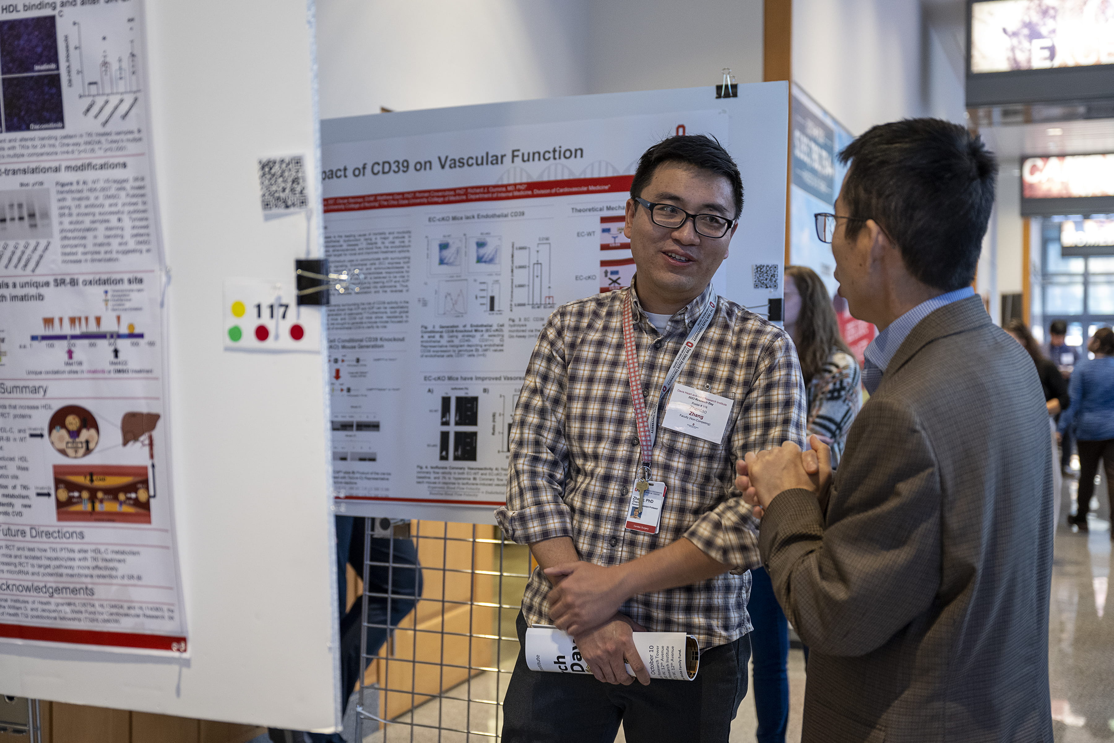 Researchers with posters at DHLRI Research Day