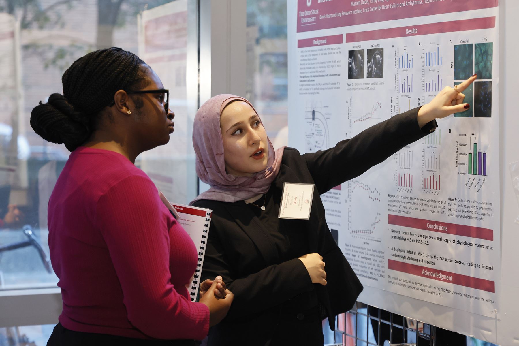 Students presenting a poster 