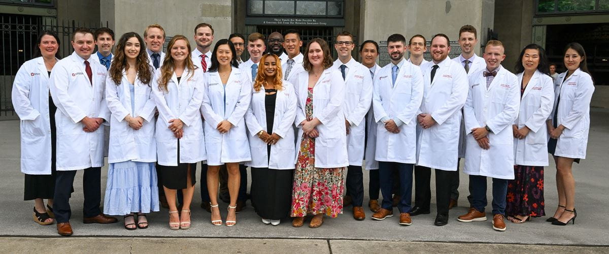 Residents standing at OSU stadium for a group photo.