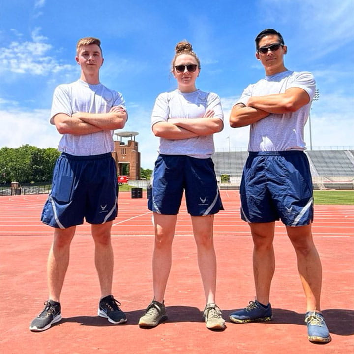 Residents standing on a track for a photo.