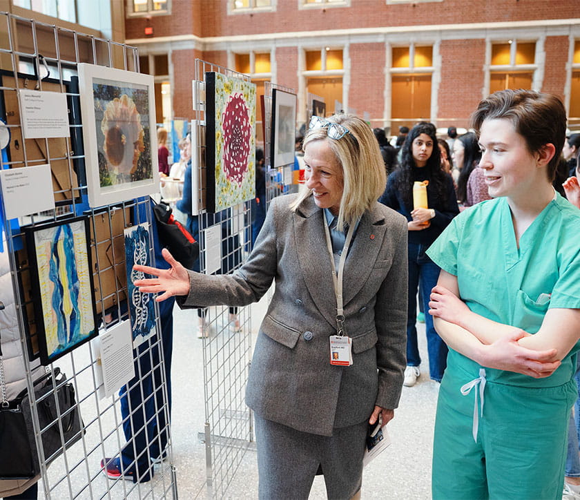 Students and faculty connect over their artwork during our weeklong Health Sciences Art Show.