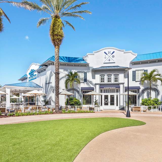 Building view, blue sky with palm trees