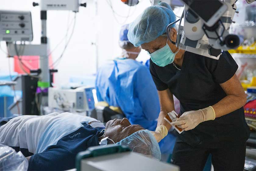 woman preps man for surgery