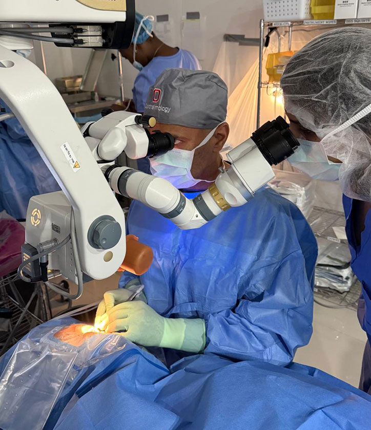 Drs. preform surgery through slit lamp