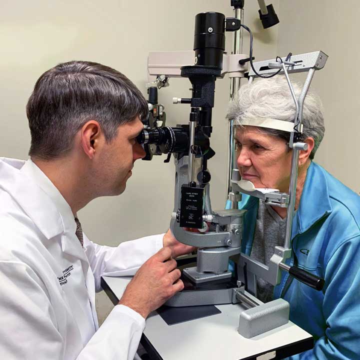 Ohr giving eye exam to elderly woman research patient