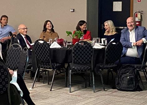 Group at event table for 8th Annual Michael J. Patzakis, MD Endowed Lectureship