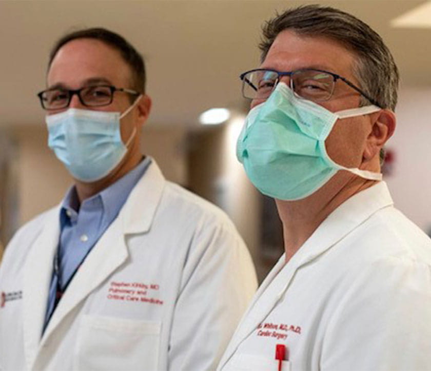 A group of people wearing masks.