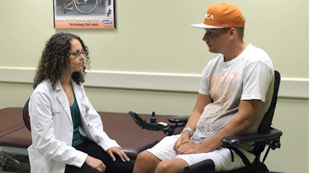 Doctor with patient in wheelchair