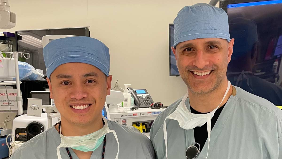 Hoang and Nimjee in scrubs