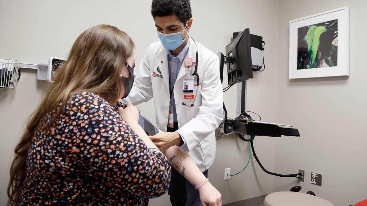 Doctor measuring patient's blood pressure