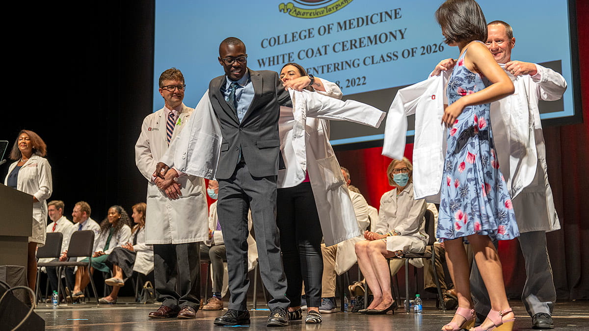 Students are putting on their white coats