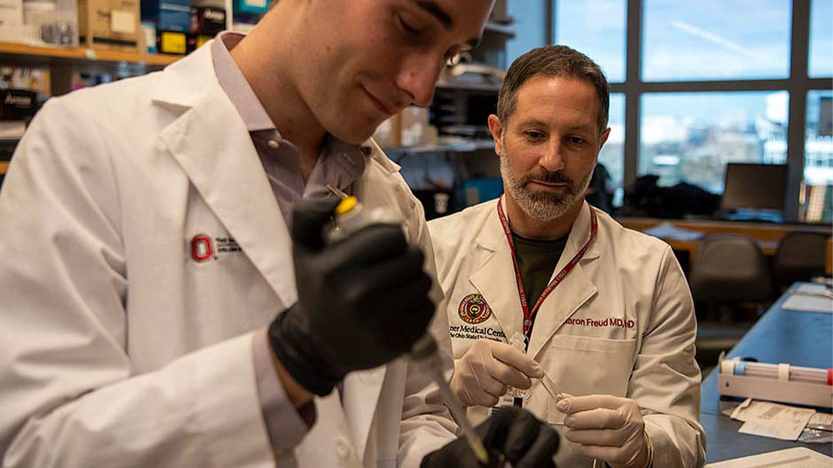 A medical student and researcher working together