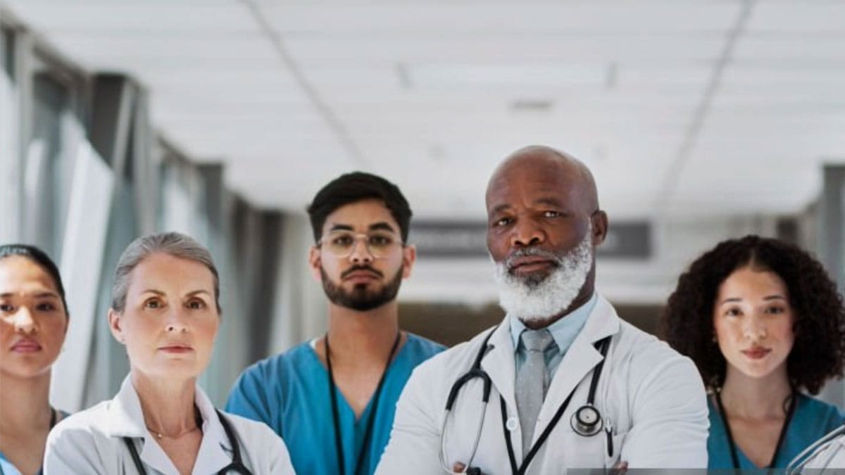 Five medical professionals standing together