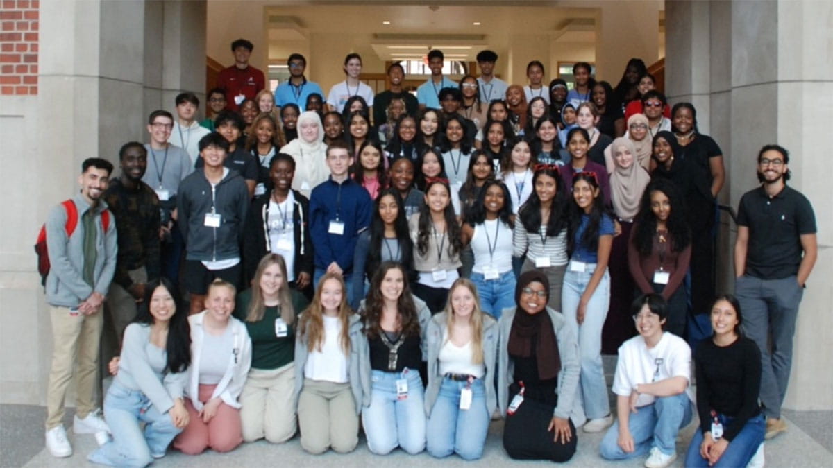 First day of camp: Students and second-year medical student counselors, from left, standing: Ramy Hassan, Israel Ailemen. Bottom, kneeling: Amy Lin, Erica Mellinger, Blair Hoeting, Teagan Carpenter, Melissa Hamrick, Lydia Copeland, Fakhtah Abdulla, David Kim, Maria Carrasco. Right, standing: Omar Alghothani. 