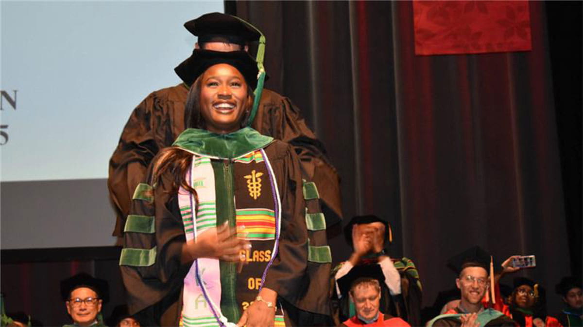 A medical student receiving their hood at The Ohio State University College of Medicine hooding ceremony.