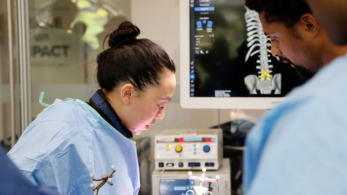 Image of a two doctors performing surgery.