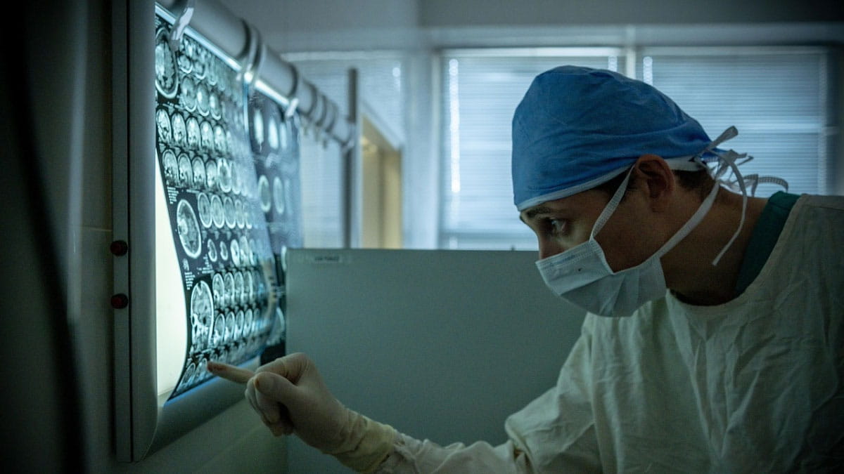 Image of a doctor review x-ray images.