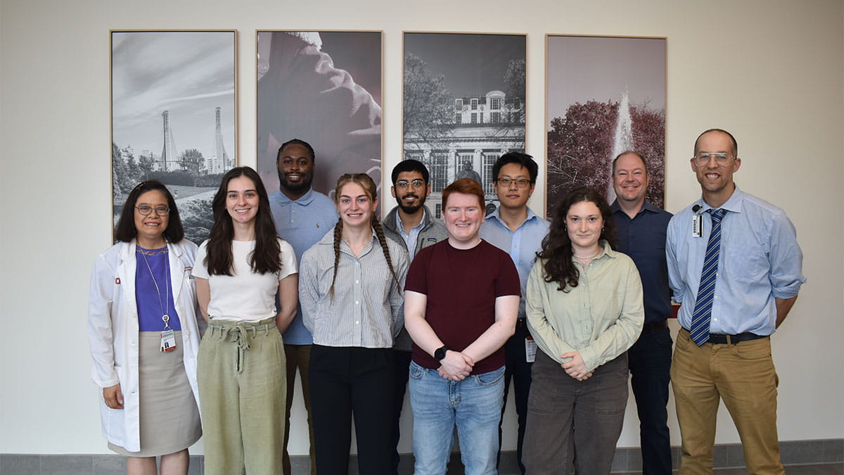 A group of ten people standing together.