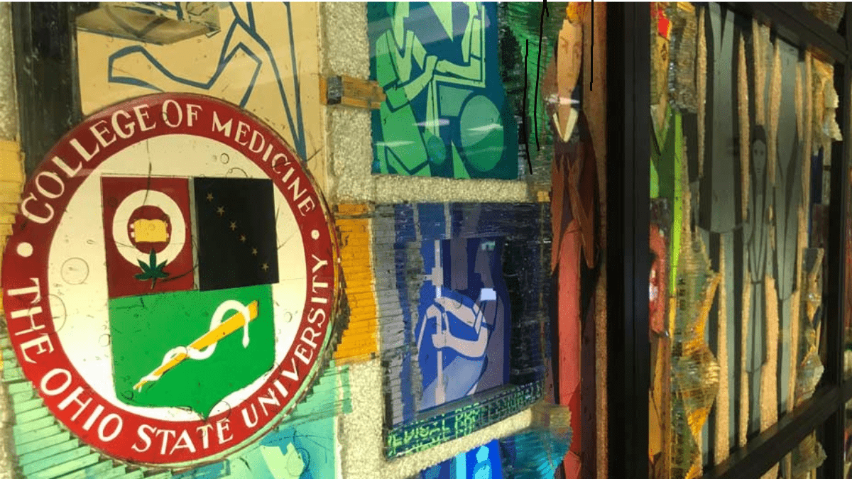 College of Medicine stained glass of seal