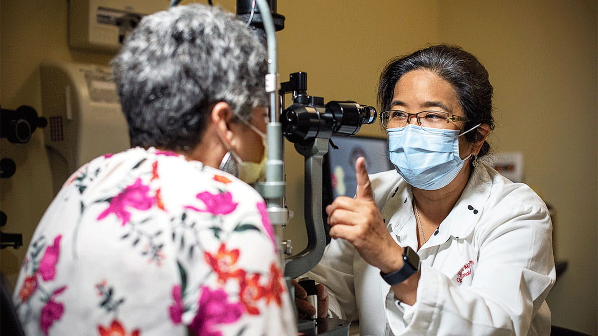 Image of a doctor doing an eye exam on a patient