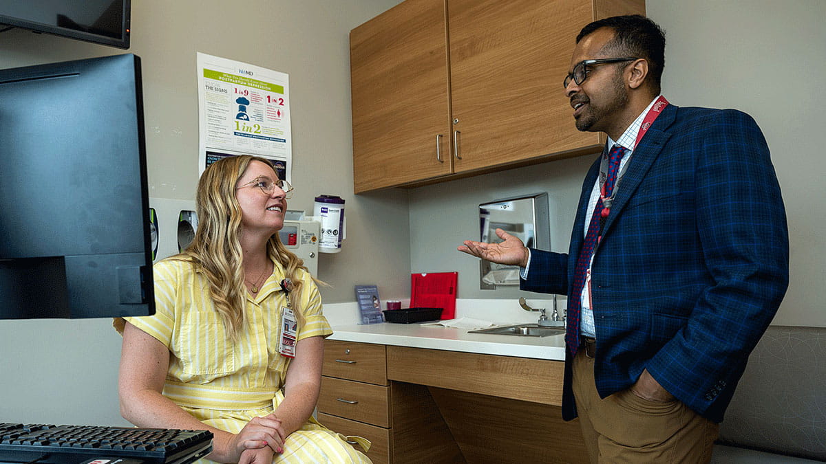 Image of a doctor speaking with a patient
