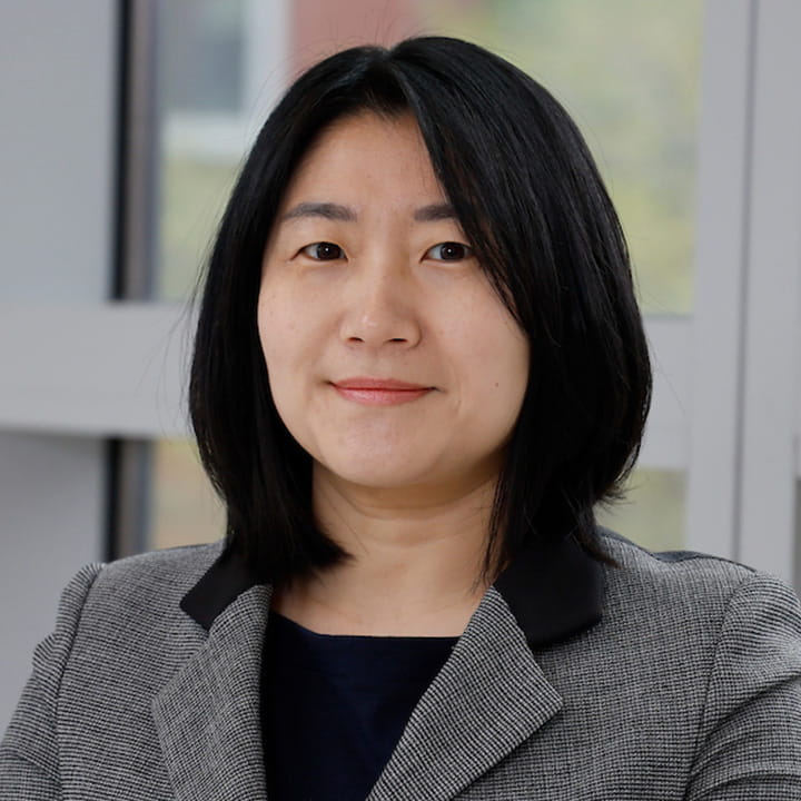 A professional portrait headshot of Joanne Kim.