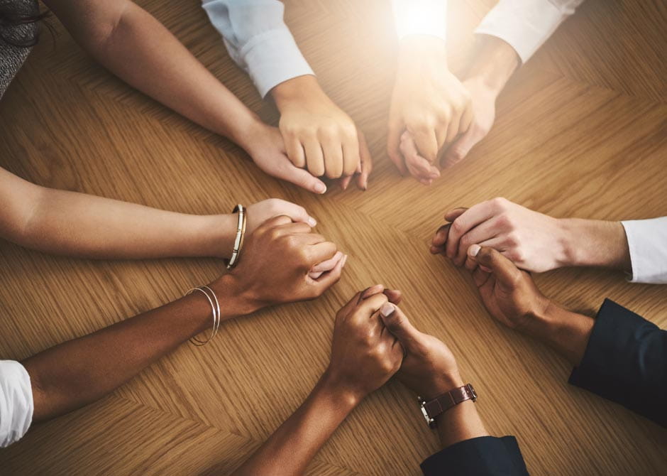Hands holding in support