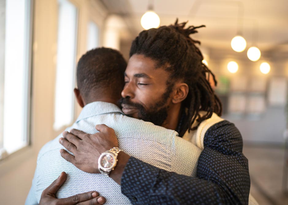 Men embracing