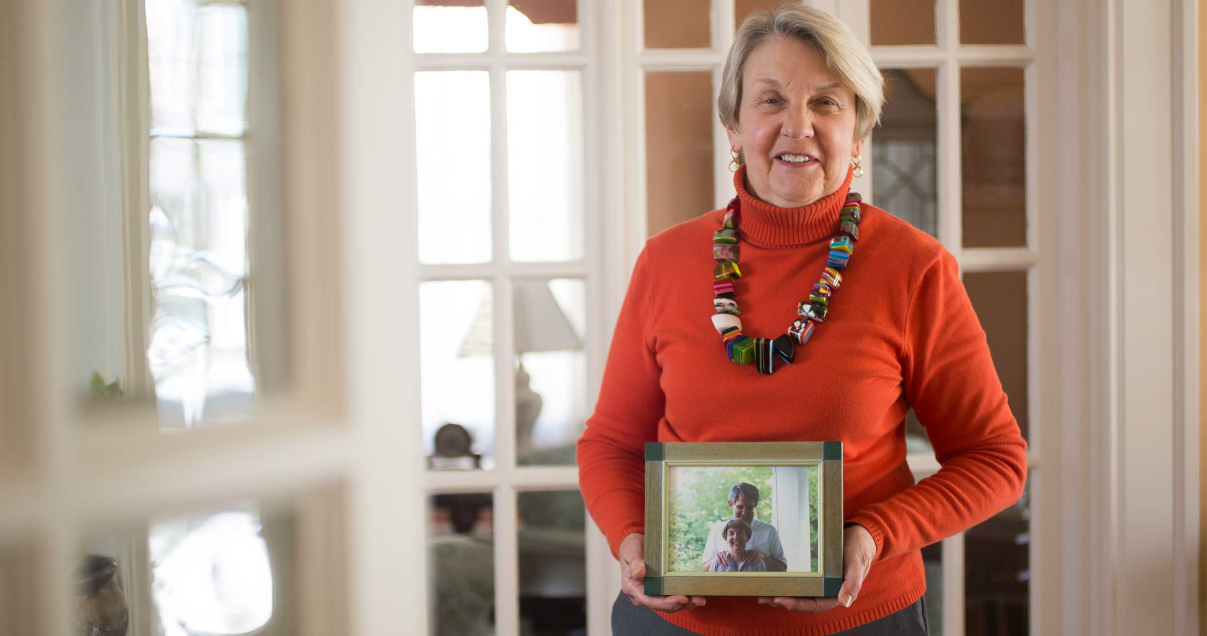 Jeanetta Pyle with photograph of husband
