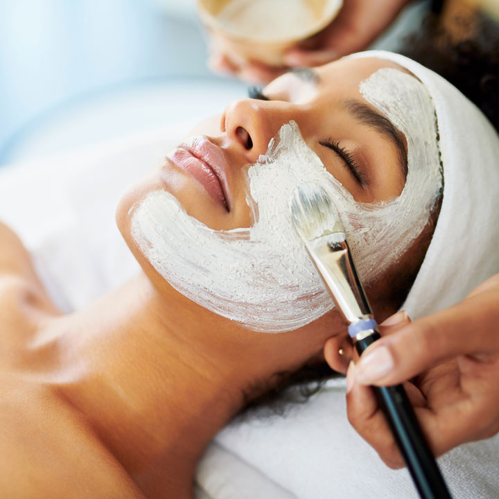 Woman having a chemical peel done to her face