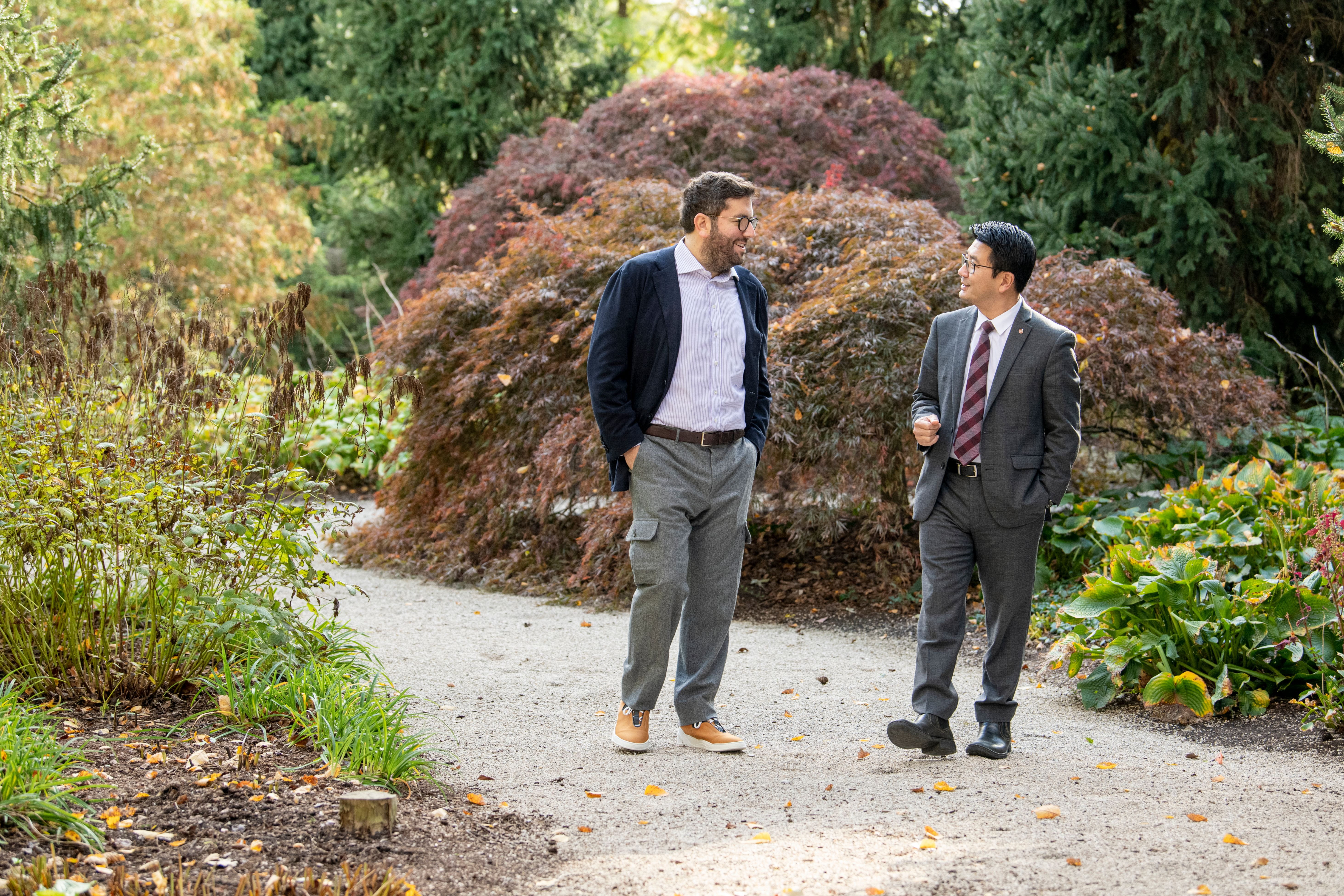 Jeffrey Schottenstein and Ohio State's Dr. Luan Phan walk on a gravel path in a garden