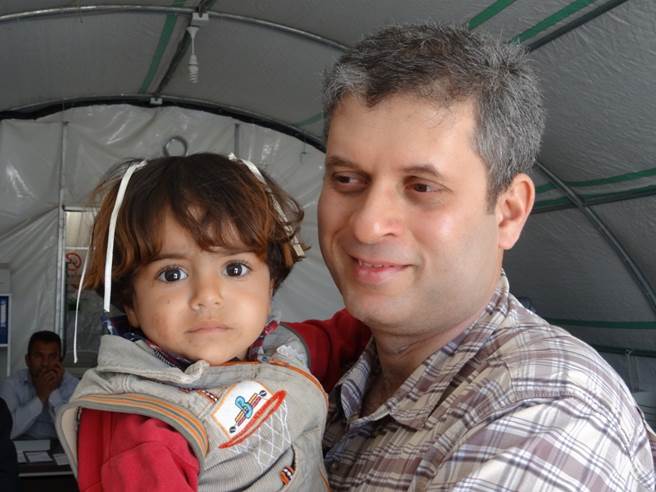Dr. Satoskar with child